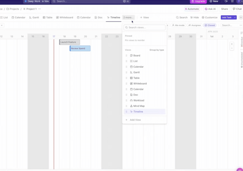 ClickUp-visning med projekt-tidslinje og menu til valg mellem views som Board, List, Calendar, Gantt, Table, Whiteboard, Doc, Workload, Mind Map og Timeline.