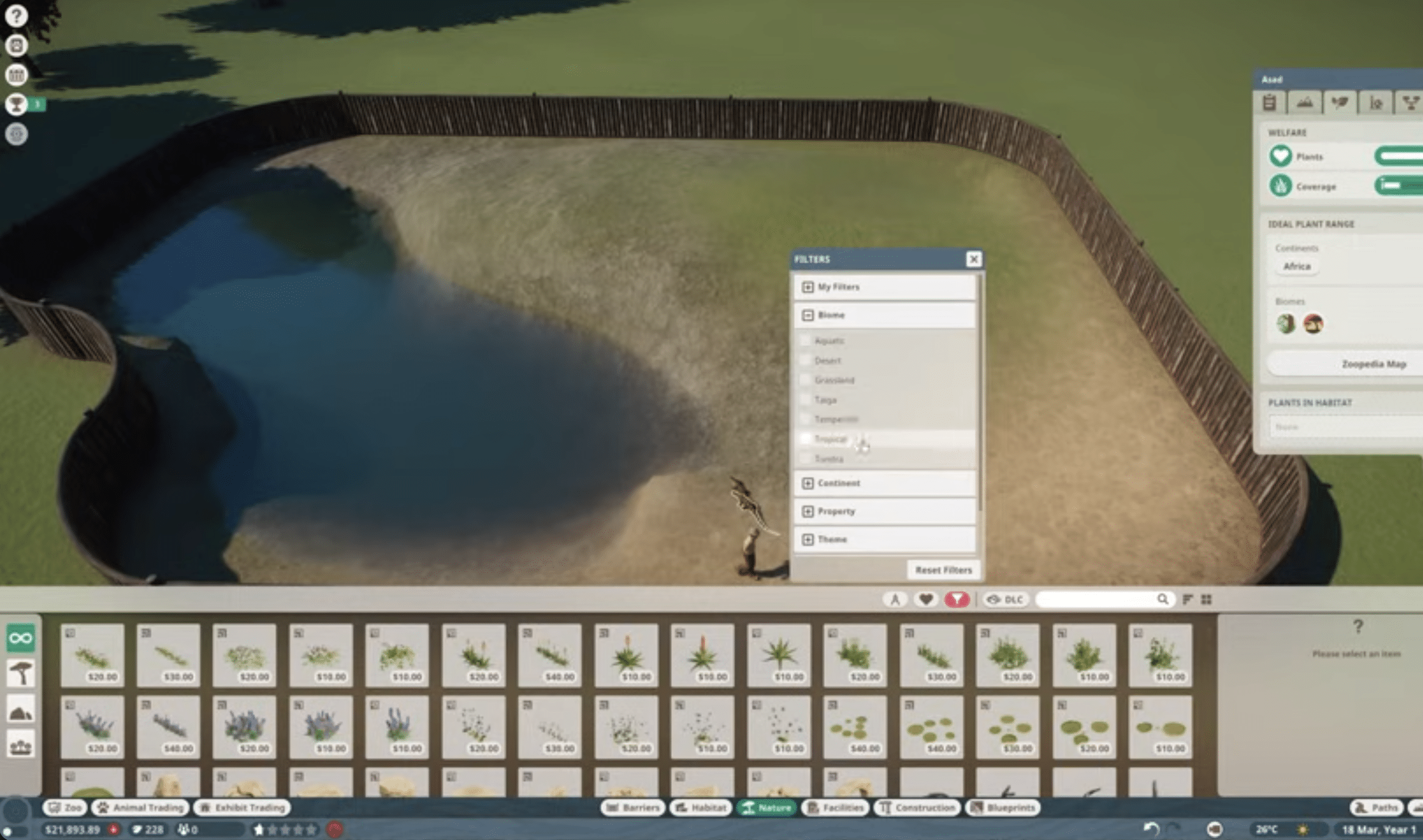 Screenshot aus unserem Test zu Planet Zoo, in dem wir ein Habitat mit Wasserstelle bauen und Pflanzen nach Biom/Region filtern.