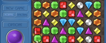 ejeweled Deluxe på pc med klassisk match-3 bræt, scorepanel og farvede juveler