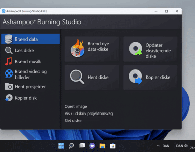 Ashampoo Burning Studio Free åbent på en Windows 11-PC, hvor hovedmenuen viser valgmuligheder som Brænd data, Læs diske, Brænd musik og Kopier disk. Programvinduet har et mørkt tema med farverige ikoner og en tydelig dansk brugerflade.