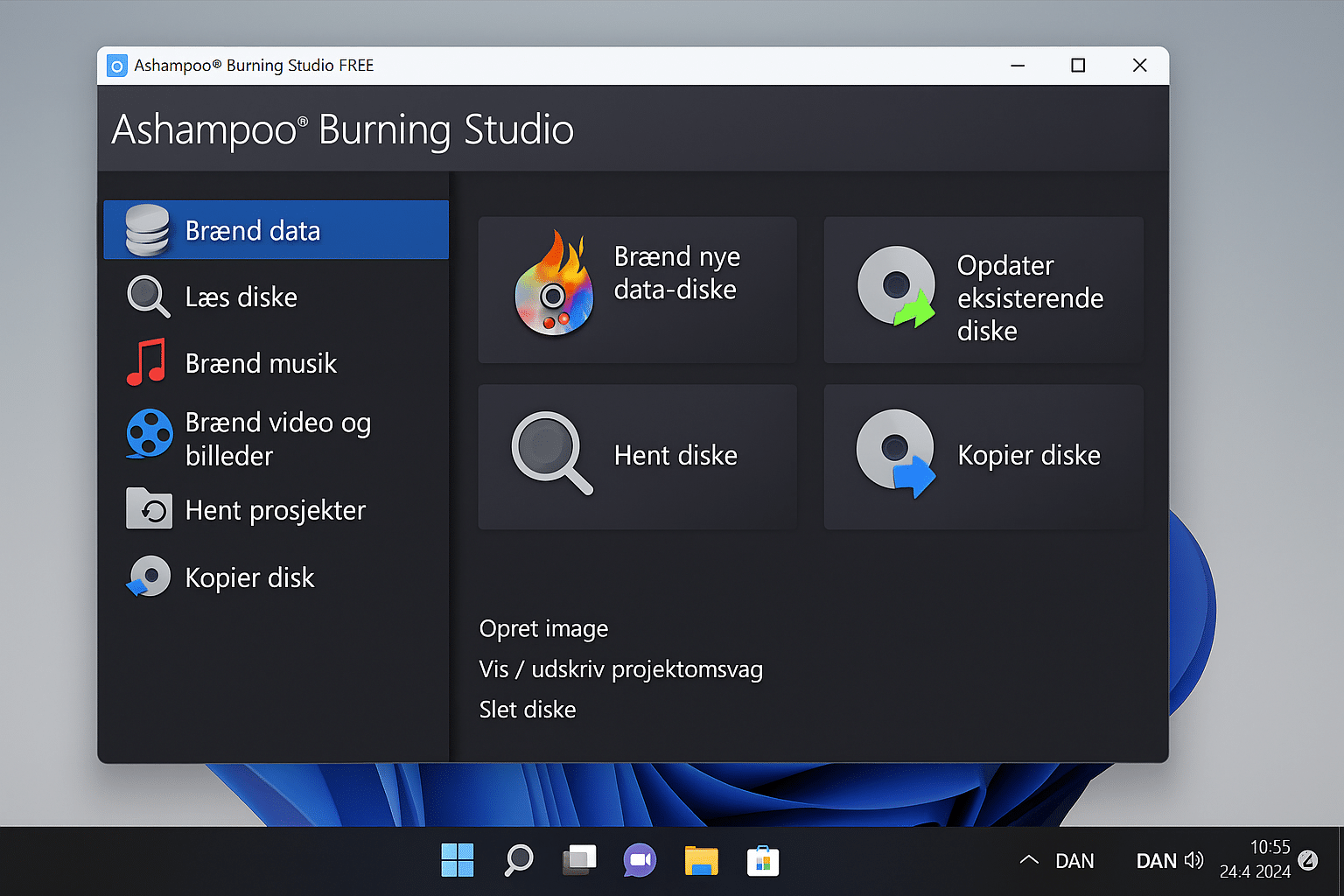 Ashampoo Burning Studio Free åpnet på en Windows 11-PC, der hovedmenyen viser valg som Brenn data, Les plater, Brenn musikk og Kopier plate. Programvinduet har et mørkt tema med fargerike ikoner og et tydelig norsk brukergrensesnitt.