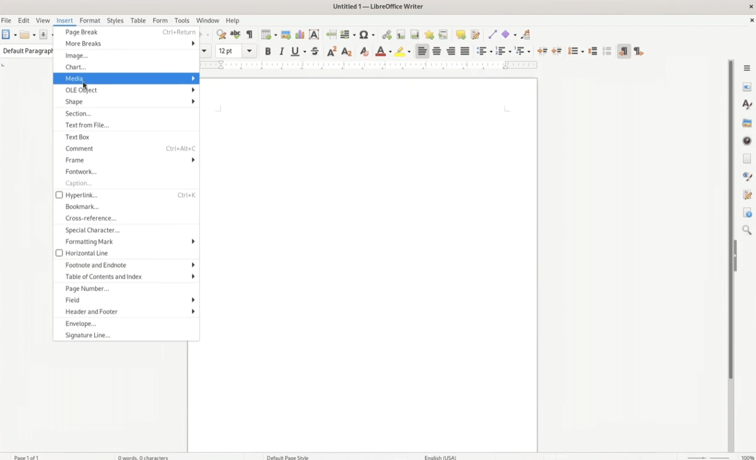 LibreOffice Writer on a Windows 11 PC with the Insert menu open and the Media option highlighted, ready to insert content into a blank document.