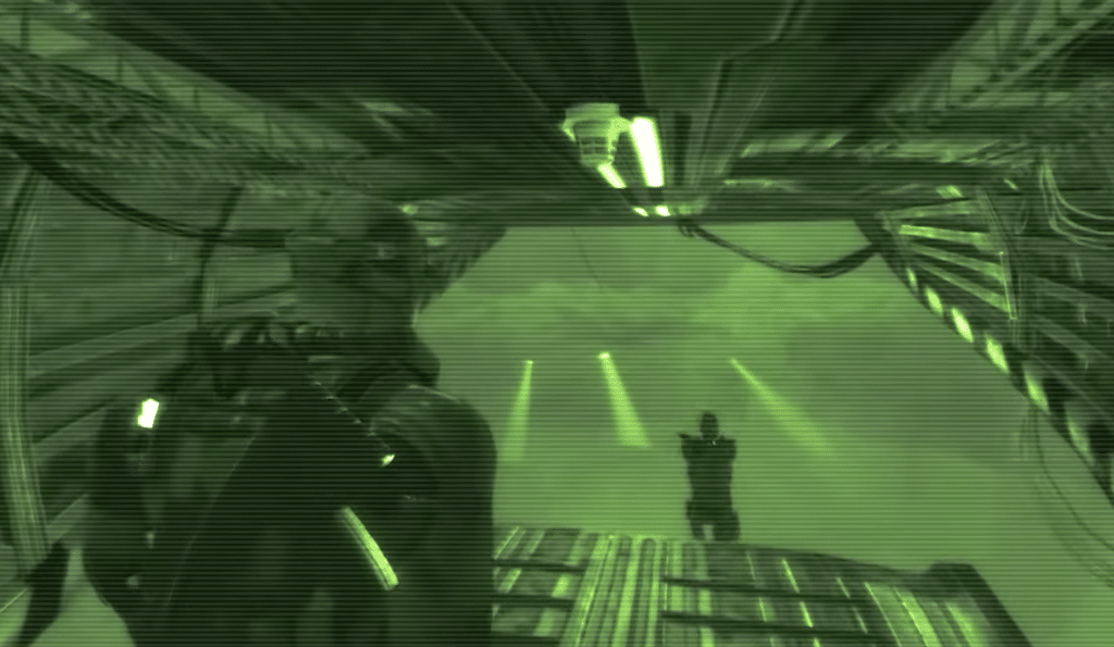 Sam Fisher in Splinter Cell: Double Agent seen through night vision as he sneaks through a dark industrial area.