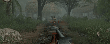 Gameplay fra Men of Valor, hvor spilleren kæmper gennem en tæt junglelandsby under Vietnamkrigen.