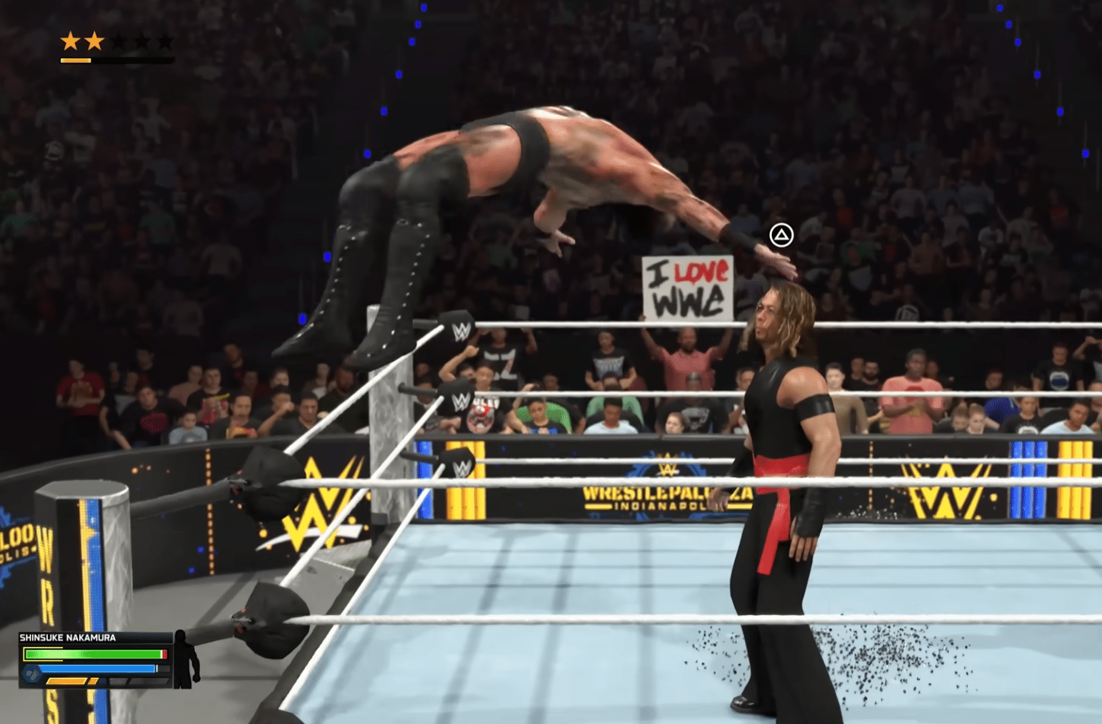 WWE 2K26 -pelikuva, jossa painija hyppää kehän kulmauksesta vastustajan päälle suuren yleisön edessä.