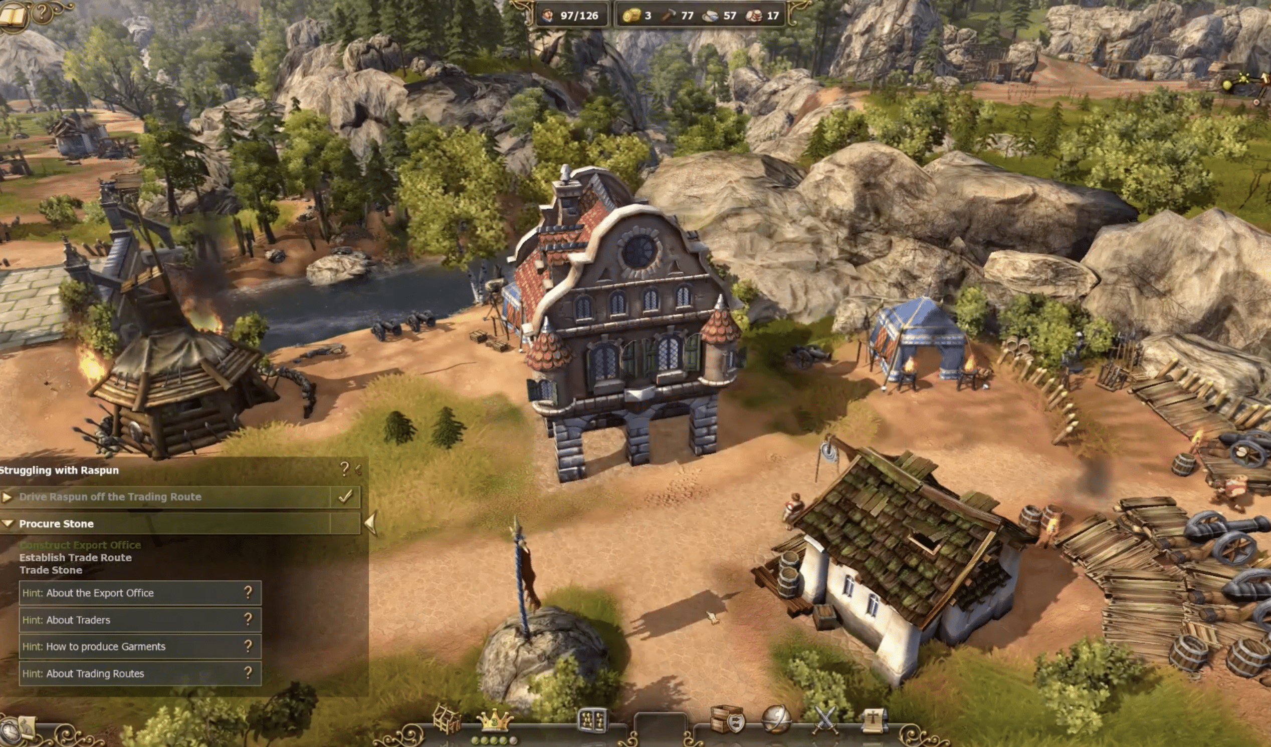 Skjermbilde fra The Settlers 7: Paths to a Kingdom, der en liten bosetning med rådhus, bygninger, soldater og ressurser sees i et frodig fjellandskap.