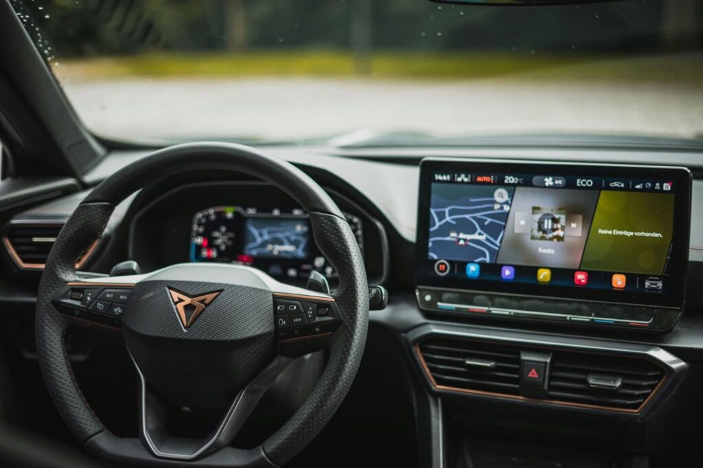 the steering wheel and dashboard of a car