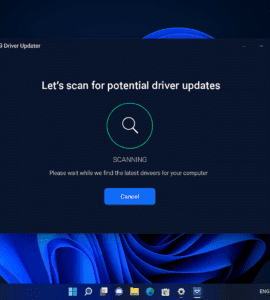 AVG Driver Updater kører på en Windows 11-computer og viser en scanning i gang for potentielle driveropdateringer. Hovedvinduet har mørk baggrund med hvid tekst og en grøn fremdriftscirkel, mens Windows 11-proceslinjen er synlig nederst på skærmen.