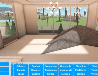 Et screenshot fra Roblox-spillet Welcome to Bloxburg, der viser byggemenuen nederst med kategorier som Cabinets, Comfort, Decorations og Lighting. I baggrunden ses et moderne lyst rum med store glaspartier, en minimalistisk lysekrone og udsigt til palmer og et grønt landskab.