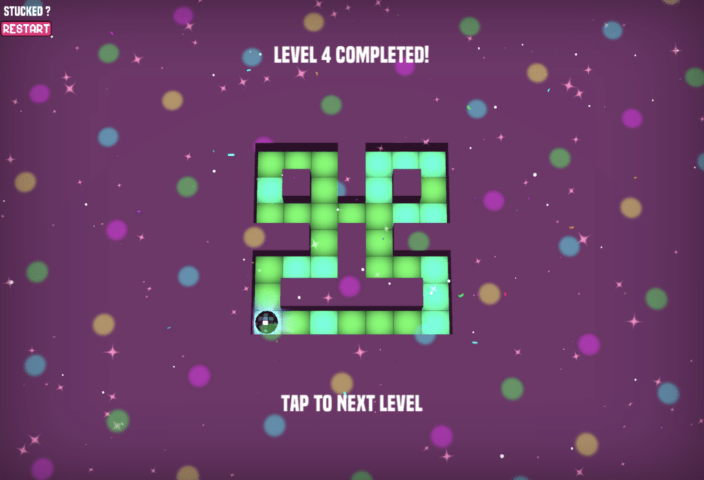 Maze Paint level 4 completed with colored tiles, confetti, and the message 'Level 4 Completed'.
