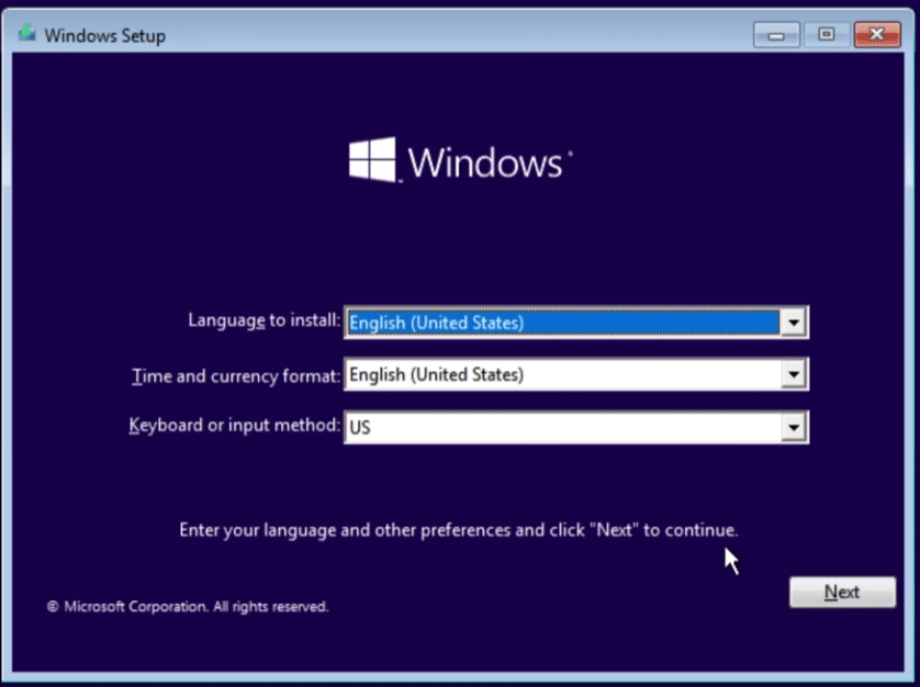 Windows 10 setup screen with language, time format, and keyboard layout selection before installation continues.